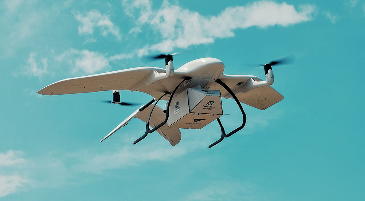 Delivery drone with a package in flight. EVTOL vehicles require quality bearings for long life and reliable flight.